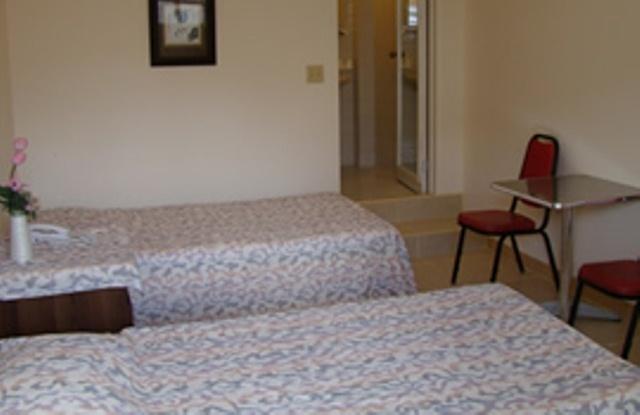 Micro Beach Hotel Garapan Zimmer foto